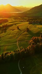 Wall Mural - Picturesque Autumn Scene Of A Mountainous Landscape At Sunset. - aerial vertical shot