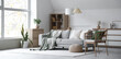 © Pixel-Shot - Interior of light living room with grey sofa, armchair and large window
