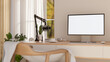 © bongkarn - White screen computer and podcast microphone aside headphone and coffee on wooden table with a chair