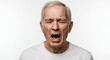 © Mono - Mature man grimaces eyes closed mouth open wearing a white shirt against a stark white background