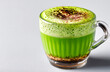 © aboutnuylove - Green tea matcha latte in a glass on a white background