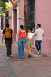 © Hector Pertuz - Tourists walking and exploring cartagena de indias colorful street