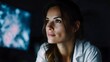 © Thares2020 - A scientist intensely studies complex data on a digital screen in a dimly lit research environment