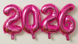 Pink foil balloons forming the number 2026, symbolizing New Year or celebration.