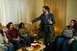 © AntonioDiaz - Drunk friend bringing some drama to a holiday party and talking everyone down