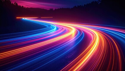 Wall Mural - Vibrant light trails from vehicles on a winding road at dusk, surrounded by trees and a colorful sky
