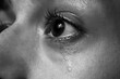 © New Africa - Closeup view of sad woman crying. Black and white effect