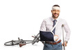 © Ljupco Smokovski - Man with a broken arm and bandage on head leaning on a crutch after bicycle accident