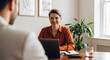 © InfinityVisuals - Professional Encounter: A composed business professional in a poised dialogue setting, creating a connection with another individual. A study of modern workplace.