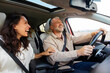 © Home-stock - Excited woman laughing and joking with her happy husband while driving to vacation spot, spouses talking and enjoying road trip
