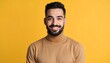 © Rejo - Portrait of a smiling, bearded man on yellow background