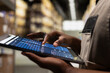 © DC Studio - Close up of industrial operations worker verifying parcel shipment details on tablet, order processing for cargo and inventory management. Transportation records for daily activities.