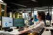 © DC Studio - Woman employee focused on IT company development with digital tools, review analytics and performance metrics at workstation. Staff planning solutions and aligning objectives.