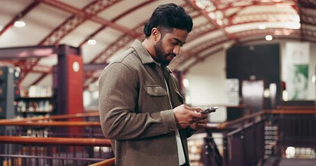 Phone, networking and man in library with typing for college email, chatting or social media on mobile app. Technology, contact and student with cellphone for texting online for university results.