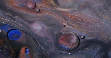 Wall Mural - Oil ink. Glitter bubbles. Defocused orange blue yellow color sparkling flow round water texture floating on abstract art background.