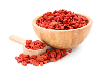 Wall Mural - Wooden bowl and spoon with red dried goji berries on white background