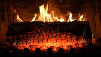 Wall Mural - a log in a cozy fireplace slowly turns to glowing embers, capturing the mesmerizing fire transformat