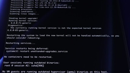 Computer screen displays programming code with Get:XX lines showing software download progress, representing active system updates, data processing, and technology development. Zoom