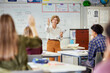 © Rido - Mature teacher interacts with students while asking questions