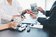© doidam10 - Customer signing car loan contract with dealer showing vehicle model, concept of auto finance, leasing, insurance or purchase agreement, business negotiation and financial planning. auto finance.
