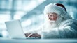 © Dreamer Studio - Santa Claus working on laptop in bright modern office symbolizing digital transformation productivity festive work balance and technology driven holiday