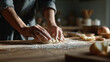 © Yaryna - Cozy scene of hands kneading dough, perfect for holiday preparation.