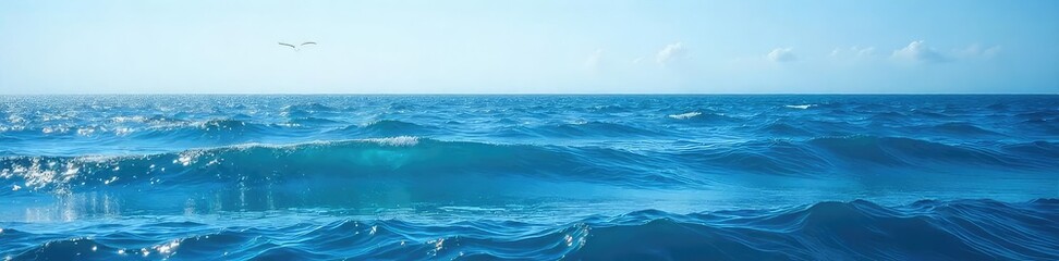 Wall Mural - Vast expanse of deep blue ocean water, waves gently rolling under a clear sky  Perfect for travel, nature, or environmental themes ,  peaceful,  ecology