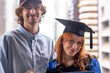 © Austockphoto - young student with her boyfriend at university graduation