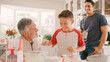 © Monkey Business - Three Generation Male Family In Kitchen At Home Having Fun Baking Together