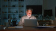 © Monkey Business - Senior Man At Home Working On Laptop And Checking Household Finances At Night