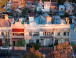 © Austockphoto - Aerial view of suburban terrace houses in golden afternoon light in West Melbourne in Victoria