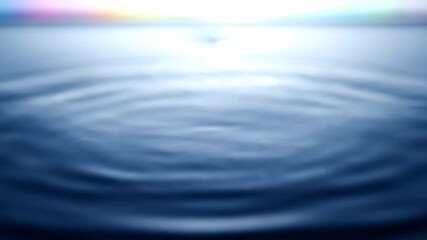 Wall Mural - hypnotic liquid ripples gently expand across a calm surface towards a blurred abstract light horizon