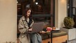 © shine.graphics - Stylish girl working on laptop at a cafe