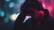 © Thares2020 - A young man wearing headphones and sunglasses lost in thought amidst blurred city lights at night with vibrant neon illumination