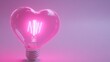 © Wallpaper - A heart-shaped light bulb glowing pink. White background