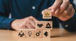 © Vodkaz - Person stacking blocks representing leadership, teamwork, and ideas for success.