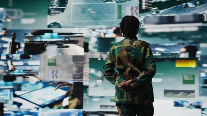Intelligence agency specialist scanning enemy rockets using digital videowall. African american woman using radar systems on laptop program to detect incoming ballistic missiles, camera A