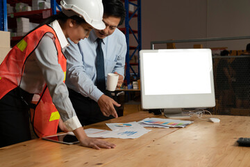 Wall Mural - Computer with green screen display in warehouse storage room . Delivery and transportation software concept .