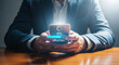 © ASMA - Man in suit holding a smartphone with a loading bar on the screen, indicating data transfer and update
