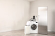 © Pixel-Shot - Different household appliances near light wall