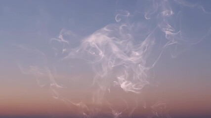 Wall Mural - abstract wisps of ethereal smoke slowly drift and swirl against a fading evening sky at dusk effect,