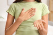 © Pixel-Shot - Young woman using sign language at home, closeup