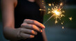 © anima - hand holding sparkler