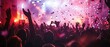 © petrrgoskov - Energetic concert crowd with raised hands and flying confetti under colorful stage lights. Nightlife festival atmosphere with live music, entertainment, audience, celebration and party concept.