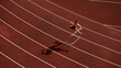 © master1305 - Aerial view of athlete jumping over hurdle on red running track with shadow. Concept of speed, discipline, determination for sports branding, motivation design, and athletic advertising visuals.
