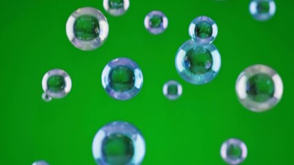 Wall Mural - Shimmering iridescent spheres slowly rain down, creating a magical falling particle effect on a green screen, captured in slow motion glitter, smooth, shimmering