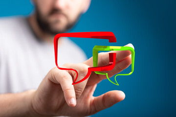 a man interacts with digital speech bubbles. illustrates communication, feedback, online conversatio