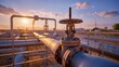 © Aliaksandr Barouski - Industrial pipeline valve and piping at sunset with warm glow