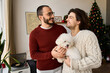© Bliss - Joyful moments of love and celebration between a couple in their cozy home during the holidays