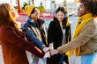 © Xavier Lorenzo - Multiracial happy friends with hands in stack. Diverse group of college students joining their hands. Stacking hand concept, community, unity and teamwork concept